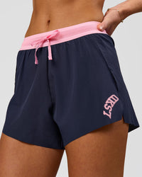 Woman wearing Accelerate 3" High-Rise Running Short - Future Navy-Varsity print | Model:Issy | Size:XS | Thumbnail Index: 0