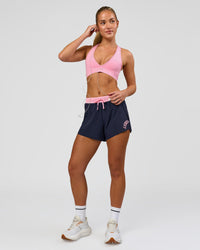 Woman wearing Accelerate 3" High-Rise Running Short - Future Navy-Varsity print | Model:Issy | Size:XS | Thumbnail Index: 1