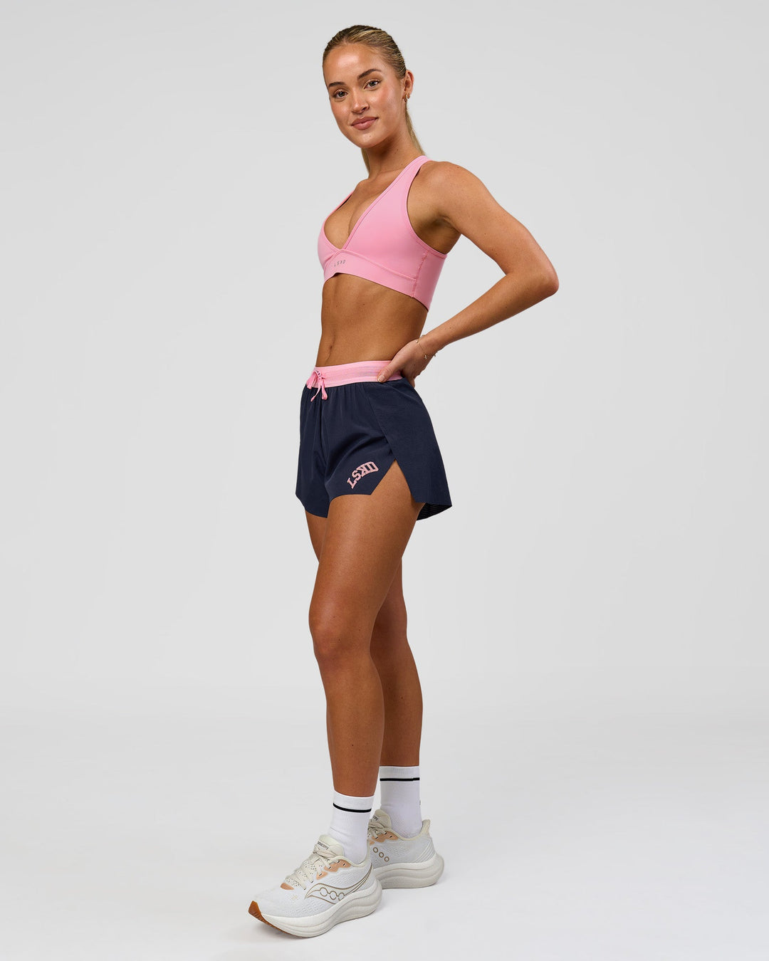 Woman wearing Accelerate 3" High-Rise Running Short - Future Navy-Varsity print | Model:Issy | Size:XS - view 12