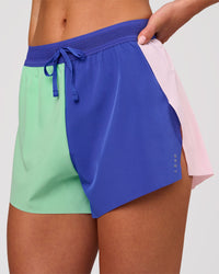 Woman wearing Accelerate 3" High-Rise Running Short - Power Cobalt-Prism | Model:Issy | Size:XS | Thumbnail Index: 9
