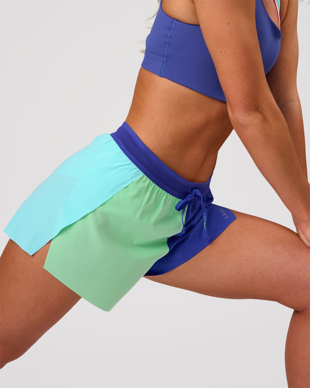 Woman wearing Accelerate 3" High-Rise Running Short - Power Cobalt-Prism | Model:Issy | Size:XS - view 7