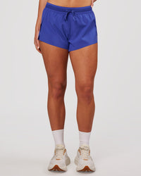 Woman wearing Accelerate 3" Mid-Rise Running Short - Power Cobalt | Model:Issy | Size:XS | Thumbnail Index: 6
