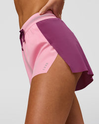 Woman wearing Accelerate 3" High-Rise Running Short - Boysenberry-Pink Rose | Model:Issy | Size:XS | Thumbnail Index: 1