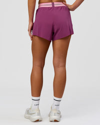 Woman wearing Accelerate 3" High-Rise Running Short - Boysenberry-Pink Rose | Model:Issy | Size:XS | Thumbnail Index: 2