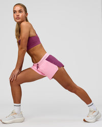 Woman wearing Accelerate 3" Mid-Rise Running Short - Boysenberry-Pink Rose | Model:Issy | Size:XS | Thumbnail Index: 5