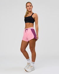 Woman wearing Accelerate 3" High-Rise Running Short - Boysenberry-Pink Rose | Model:Issy | Size:XS | Thumbnail Index: 6