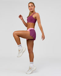 Woman wearing Accelerate 3" Mid-Rise Running Short - Boysenberry-Pink Rose | Model:Issy | Size:XS | Thumbnail Index: 7