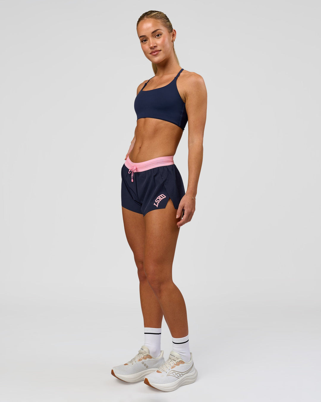 Woman wearing Accelerate 3" Mid-Rise Running Short - Future Navy-Varsity Print | Model:Issy | Size:XS - view 5