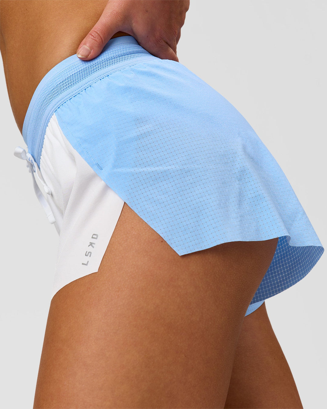 Woman wearing Accelerate 3" Mid-Rise Running Short - Open Air-White | Model:Issy | Size:XS - view 9