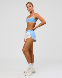 Woman wearing Accelerate 3" Mid-Rise Running Short - Open Air-White | Model:Issy | Size:XS | Thumbnail Index: 10
