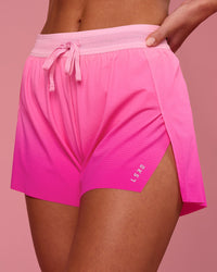 Woman wearing Accelerate Gradient 3" High-Rise Running Short - Pink Rose-Ultra Pink Gradient | Model:Issy | Size:XS | Thumbnail Index: 0