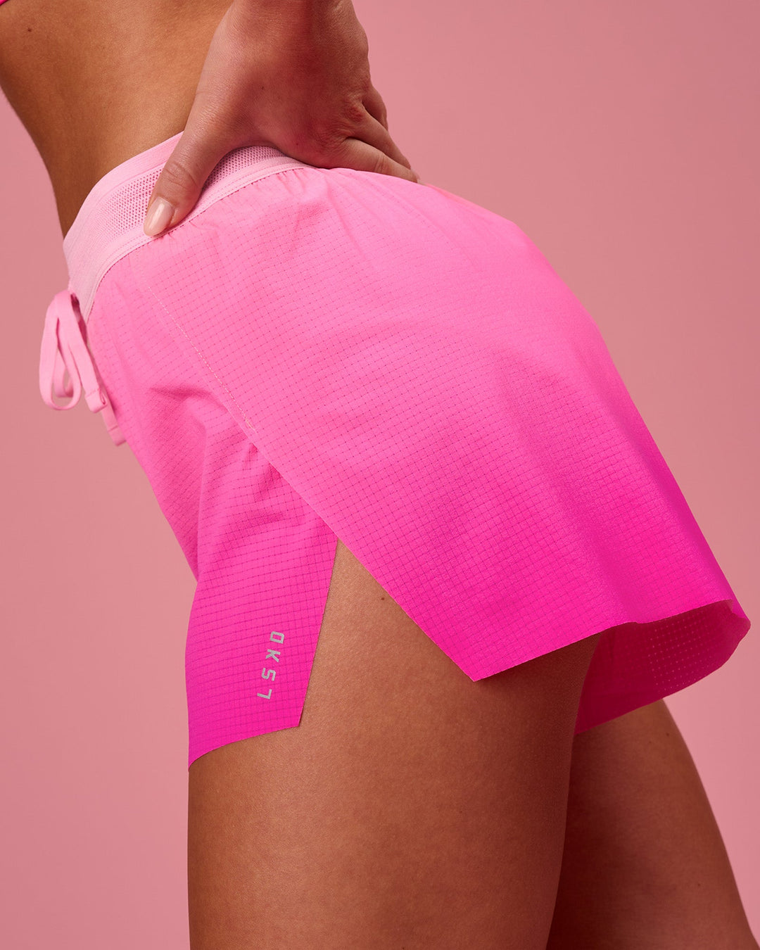 Woman wearing Accelerate Gradient 3" High-Rise Running Short - Pink Rose-Ultra Pink Gradient | Model:Issy | Size:XS - view 3