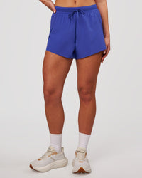 Woman wearing Accelerate 3" High-Rise Running Short - Power Cobalt | Model:Issy | Size:XS | Thumbnail Index: 7
