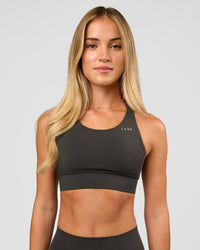 Woman wearing Accelerate Sports Bra - Onyx | Model:Issy | Size:XS | Thumbnail Index: 4