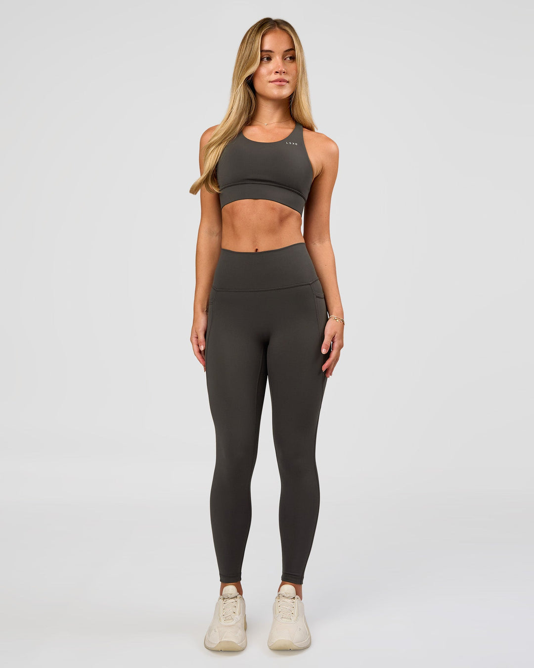 Woman wearing Accelerate Sports Bra - Onyx | Model:Issy | Size:XS - view 7