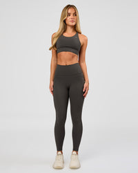 Woman wearing Accelerate Sports Bra - Onyx | Model:Issy | Size:XS | Thumbnail Index: 6