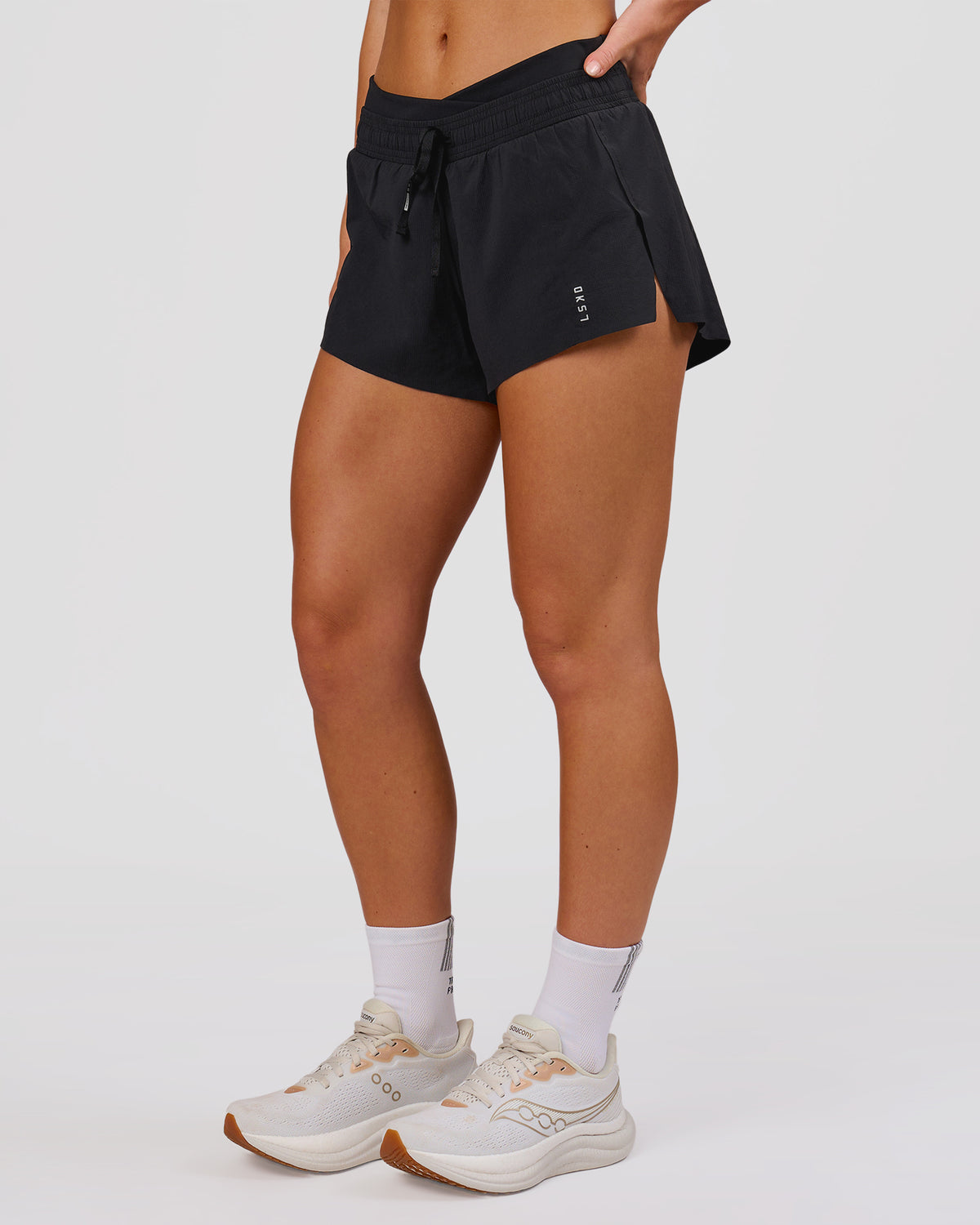 Woman wearing Accelerate Synergy 3" Running Short Short - Black-Black | Model:Issy | Size:XS - view 2