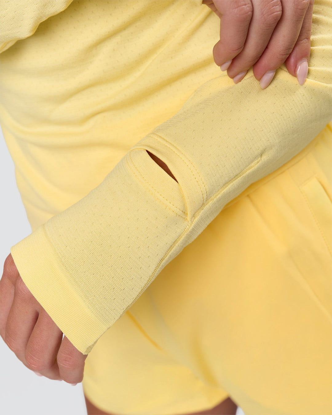 Woman wearing AeroFLX+ Long Sleeve Half Zip - Lemon/Lemon | Model:Issy | Size:XS - view 9