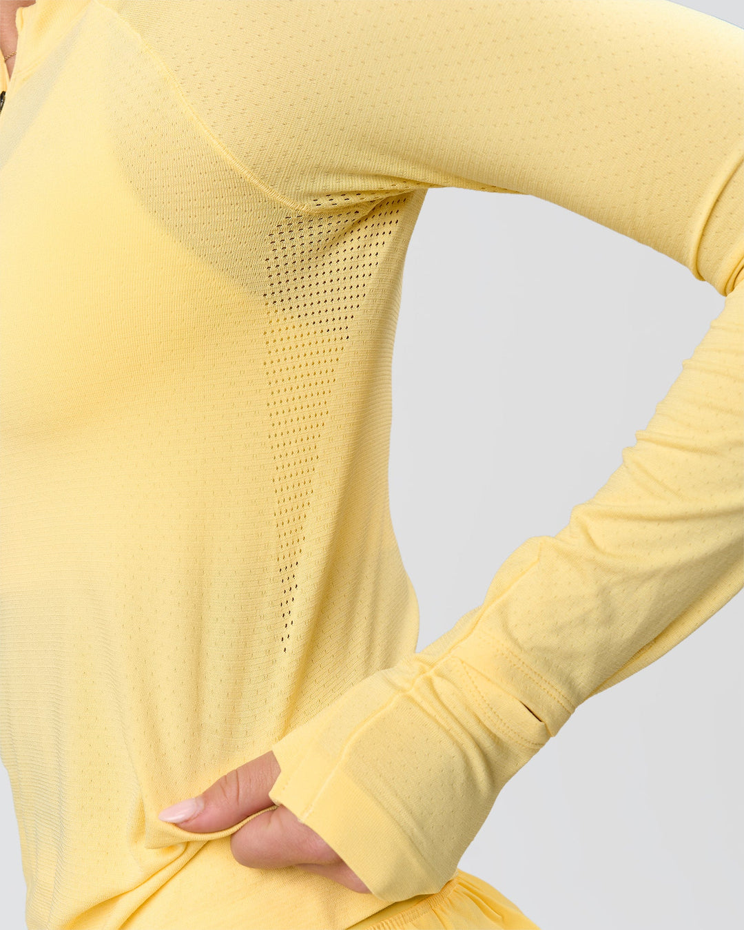 Woman wearing AeroFLX+ Long Sleeve Half Zip - Lemon/Lemon | Model:Issy | Size:XS - view 12