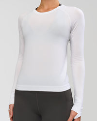 Woman wearing AeroFLX+ Seamless Long Sleeve Tee - White/White | Model:Issy | Size:XS | Thumbnail Index: 2