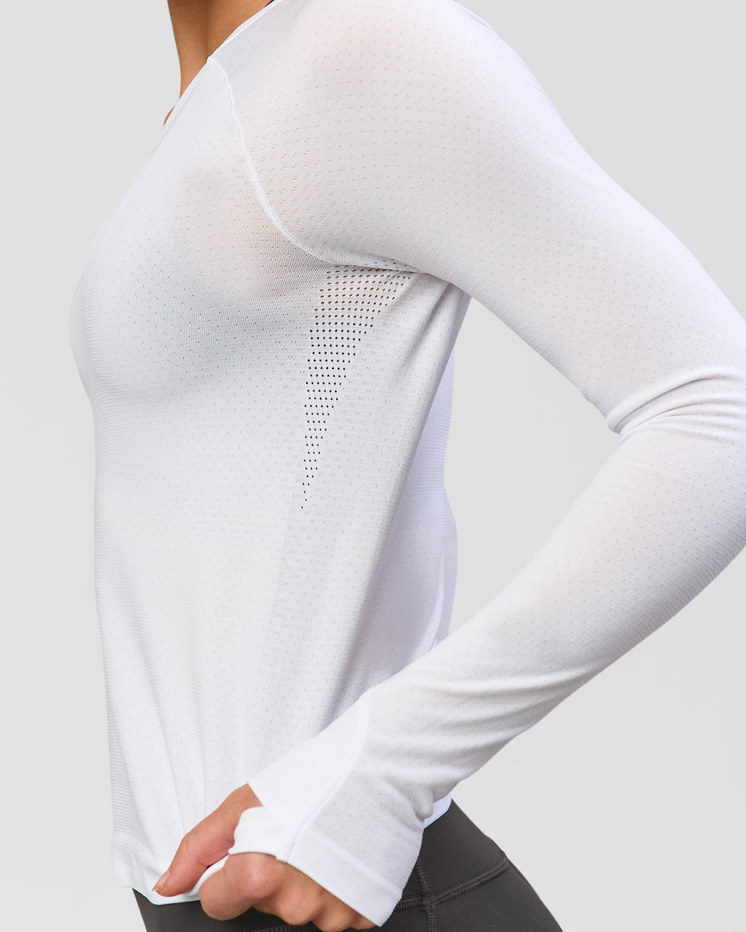 Woman wearing AeroFLX+ Seamless Long Sleeve Tee - White/White | Model:Issy | Size:XS - view 6