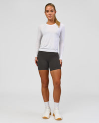 Woman wearing AeroFLX+ Seamless Long Sleeve Tee - White/White | Model:Issy | Size:XS | Thumbnail Index: 7