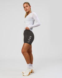 Woman wearing AeroFLX+ Seamless Long Sleeve Tee - White/White | Model:Issy | Size:XS | Thumbnail Index: 8