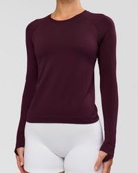 Woman wearing AeroFLX+ Seamless Long Sleeve Tee - Cherry Lacquer/Cherry Lacquer | Model:Issy | Size:XS | Thumbnail Index: 1