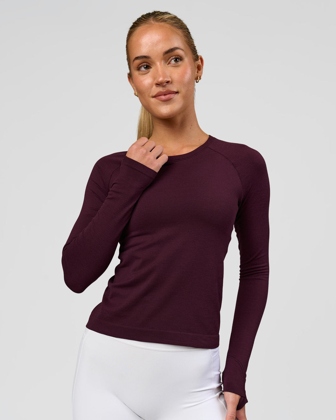 Woman wearing AeroFLX+ Seamless Long Sleeve Tee - Cherry Lacquer/Cherry Lacquer | Model:Issy | Size:XS - view 1