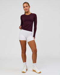 Woman wearing AeroFLX+ Seamless Long Sleeve Tee - Cherry Lacquer/Cherry Lacquer | Model:Issy | Size:XS | Thumbnail Index: 2
