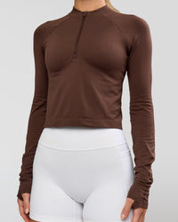 Woman wearing AeroFLX+ Long Sleeve Skimmer Half Zip - Hot Chocolate/Hot Chocolate | Model:Issy | Size:XS | Thumbnail Index: 6
