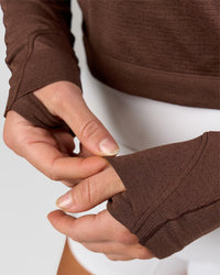 Woman wearing AeroFLX+ Long Sleeve Skimmer Half Zip - Hot Chocolate/Hot Chocolate | Model:Issy | Size:XS | Thumbnail Index: 10