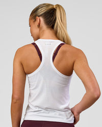 Woman wearing AeroFLX+ Seamless Tank - White/White | Model:Issy | Size:XS | Thumbnail Index: 3