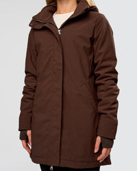 Woman wearing Auxiliary 2.0 Longline Jacket - Hot Chocolate | Model:Issy | Size:XS | Thumbnail Index: 1