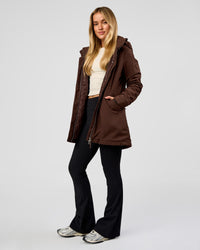 Woman wearing Auxiliary 2.0 Longline Jacket - Hot Chocolate | Model:Issy | Size:XS | Thumbnail Index: 3