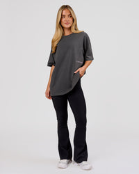 Woman wearing Backline Washed Heavyweight Oversized Tee - Asphalt Washed | Model:Issy | Size:XS | Thumbnail Index: 3