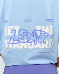 Woman wearing Benchmark FLXCotton Oversized Tee - Open Air-Blue Bell | Model:Issy | Size:XS