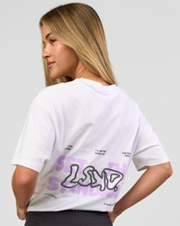 Woman wearing Benchmark FLXCotton Oversized Tee - White-Pale Lilac | Model:Issy | Size:XS | Thumbnail Index: 11