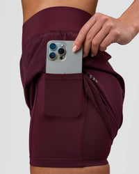 Woman wearing Challenger 3" Lined Performance Short - Cherry Lacquer | Model:Issy | Size:XS | Thumbnail Index: 1