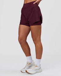 Woman wearing Challenger 3" Lined Performance Short - Cherry Lacquer | Model:Issy | Size:XS | Thumbnail Index: 4