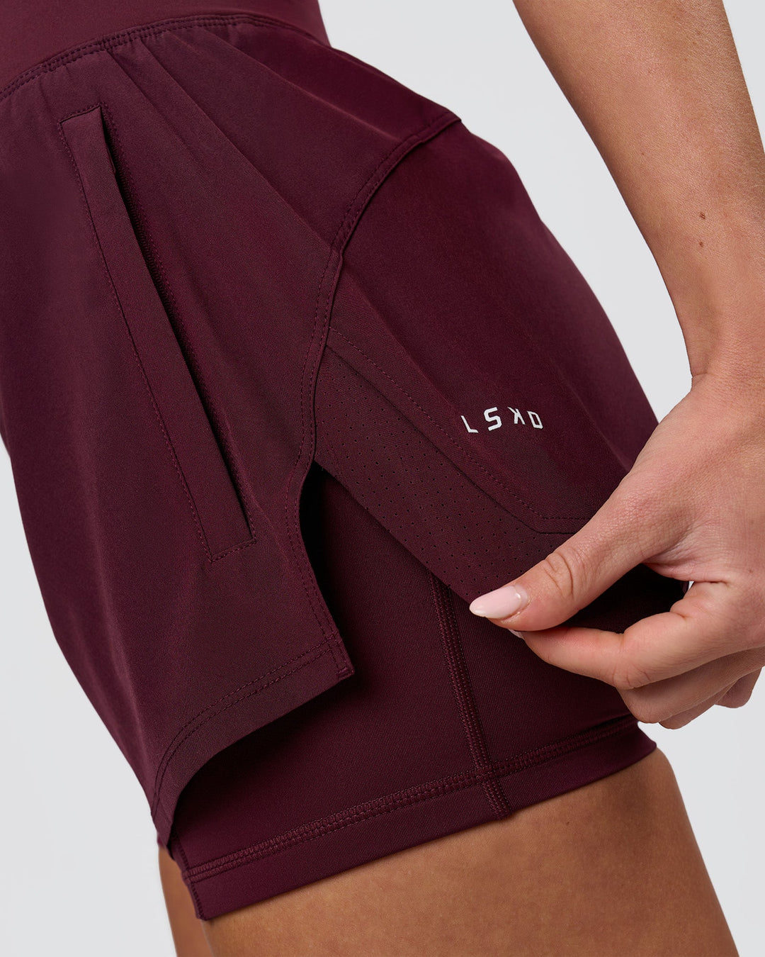Woman wearing Challenger 3" Lined Performance Short - Cherry Lacquer | Model:Issy | Size:XS - view 8