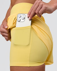Woman wearing Challenger 3" Lined Performance Short - Lemon | Model:Issy | Size:XS | Thumbnail Index: 1