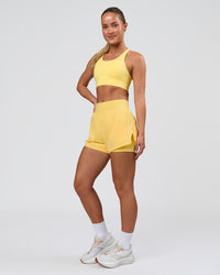 Woman wearing Challenger 3" Lined Performance Short - Lemon | Model:Issy | Size:XS | Thumbnail Index: 2