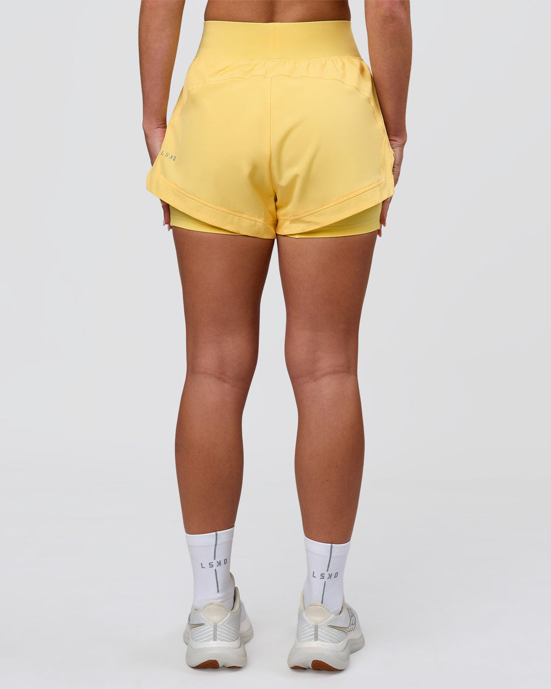 Woman wearing Challenger 3" Lined Performance Short - Lemon | Model:Issy | Size:XS - view 4