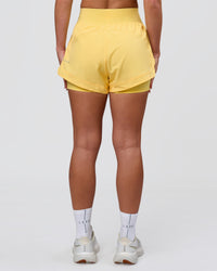Woman wearing Challenger 3" Lined Performance Short - Lemon | Model:Issy | Size:XS | Thumbnail Index: 3