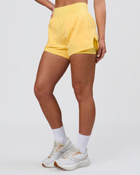 Woman wearing Challenger 3" Lined Performance Short - Lemon | Model:Issy | Size:XS | Thumbnail Index: 6