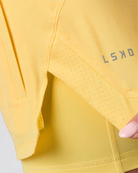 Woman wearing Challenger 3" Lined Performance Short - Lemon | Model:Issy | Size:XS | Thumbnail Index: 9