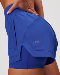 Woman wearing Challenger 3" Lined Performance Short - Power Cobalt | Model:Issy | Size:XS | Thumbnail Index: 1