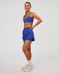 Woman wearing Challenger 3" Lined Performance Short - Power Cobalt | Model:Issy | Size:XS | Thumbnail Index: 4