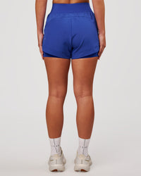 Woman wearing Challenger 3" Lined Performance Short - Power Cobalt | Model:Issy | Size:XS | Thumbnail Index: 7